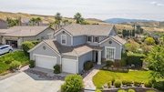 Aerial view of a modern two-story gray house in California