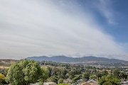 View of houses in California, leading to distant mountains