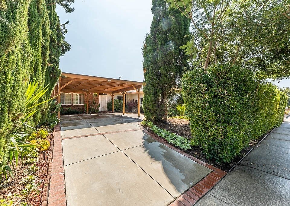 Single-story house with a wooden carport in California