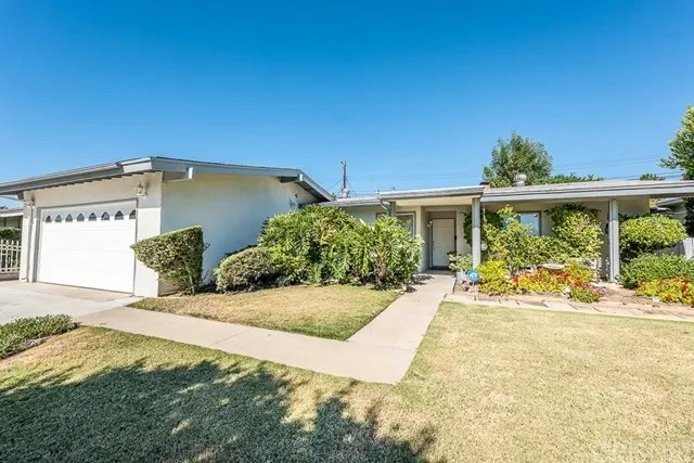 Single-story white house with attached garage in California