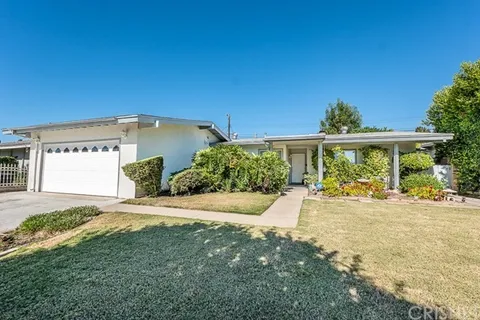 Single-story white house with garage in California