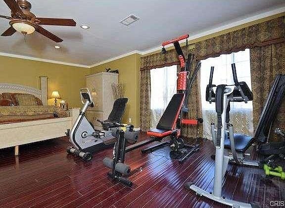 Bedroom in California with home gym equipment